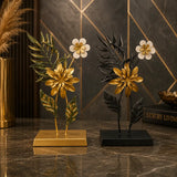 Luxury gold floral sculpture with dark foliage decorative pedestal